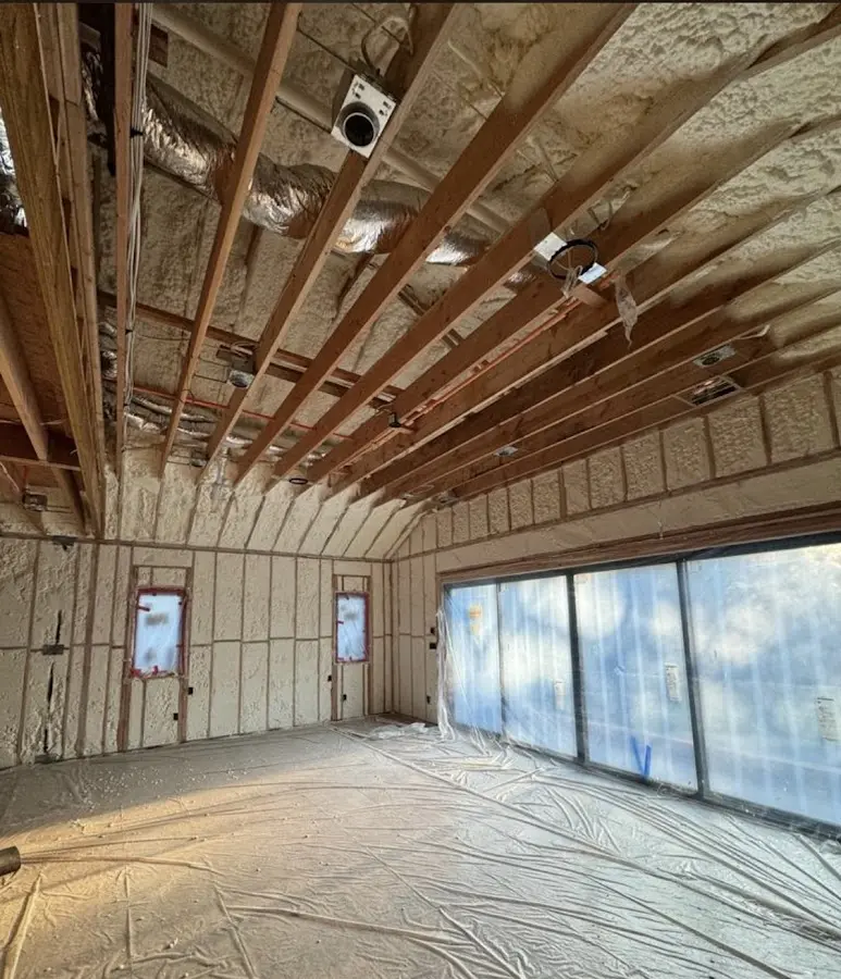 Interior walls and ceiling insulated with spray foam during new construction in Darby
